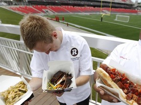 The chefs from Levy Restaurants at TD Place, executive chef Cameron Bryce (left) and chef Jonathan Williams, show off some of their top picks for food offerings at the new stadium.