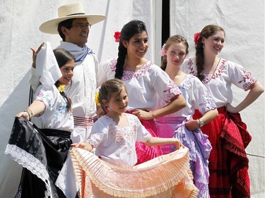 The dance group Peru Contigo pose for a photo before their performance at the Carnival of Cultures at City Hall in Ottawa on Saturday, July 5, 2014.