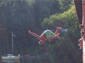 Quebec police have banned swimmers from jumping from the famous red covered bridge at Wakefield.