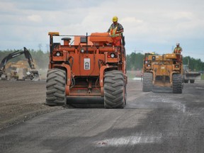 The mammoth paving job is one of the final parts of a complex, $30-million reconstruction of the Ottawa airport's north-south runway 14/32, which is more than three kilometres long and 60 metres wide.