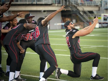 The Redblacks loved their selfies at the official opening of TD Place at Lansdowne Wednesday July 9. 2014.