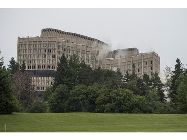 The Sir John Carling building implodes as it is demolished in Ottawa on Sunday, July 13, 2014. The former headquarters of Agriculture and Agri-Food Canada at 930 Carling, completed in 1967, is being demolished at a cost of $4.8 million.