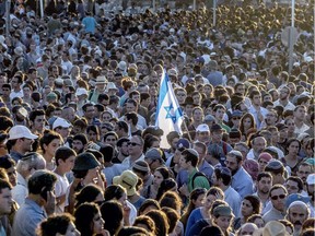 Tens of thousands Israelis attend the joint funeral of Gilad Shaer, 16, Naftali Frenkel, 16, and Eyal Ifrach, 19, in the central Israeli town of Modiin on July 1, 2014.