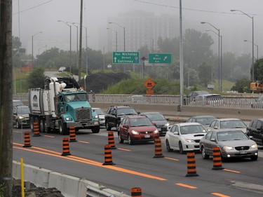 Traffic on the eastbound Queensway / 417 moves slowly through the downtown core after this tractor trailer jack-knifed just east of Nicholas St. in Ottawa, Thursday, July 31, 2014. No injuries reported.