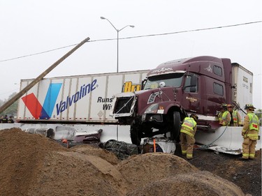 Traffic on the eastbound Queensway/417 was moving slowly through the downtown core after this tractor trailer jackknifed near Nicholas St. in Ottawa, Thursday, July 31, 2014.