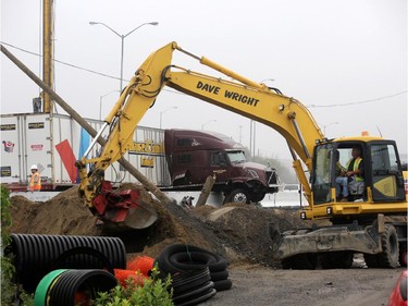 Traffic on the eastbound Queensway / 417 was moving slowly through the downtown core after this tractor trailer jackknifed near Nicholas St. in Ottawa, Thursday, July 31, 2014.