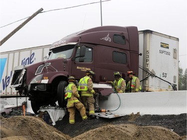 A tractor trailer jackknifed on highway 417 near Nicholas St. in Ottawa, Thursday, July 31, 2014.