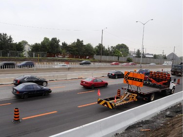 Traffic on the eastbound Queensway / 417 was moving slowly through the downtown core after a tractor trailer jackknifed near Nicholas St. in Ottawa, Thursday, July 31, 2014.