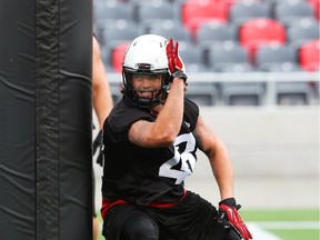 Travis Brown of the Ottawa RedBlacks goes through practice drills.