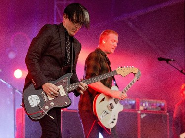 Troy Van Leeuwen, left, and Josh Homme of the band Queens of the Stone Age on the Claridge Stage at Bluesfest.