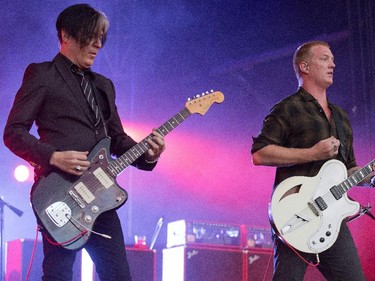 Troy Van Leeuwen, left, and Josh Homme of the band Queens of the Stone Age on the Claridge Stage at Bluesfest.