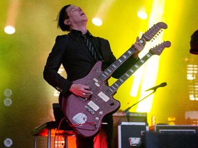Troy Van Leeuwen of the band Queens of the Stone Age on the Claridge Stage at Bluesfest. Assignment 117634 Photo taken at 20:48 on July 8, 2014. (Wayne Cuddington/Ottawa Citizen)