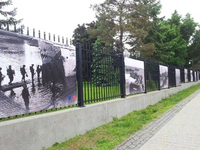 The man that returned the photo banners to the French Embassy said his younger brother had taken them "as a gift for his grandfather," a Second World War veteran. The two photo banners that were taken are shown second and third from the left.