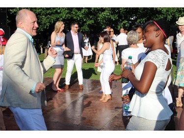 U.S. Ambassador Bruce Heyman danced with guests at his embassy's annual Independence Day party, held at his official residence in Rockcliffe Park on Friday, July 4, 2014.