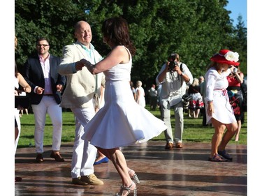 United States Ambassador Bruce Heyman (L) dances with his wife Mrs. Vicki Heyman  as they host the annual Fourth of July Independence Day celebration at their residence in Ottawa, July 04, 2014.