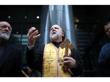 Very Rev. Peter Galadza speaks during a vigil outside the Netherlands Embassy, as tension grows in Ukraine and Russia over the downing of a Malaysian Passenger Jet this past week.