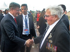 Veteran Roly Armitage shaking hands with Stephen Harper at the D-Day anniversary event this spring in Normandy.
