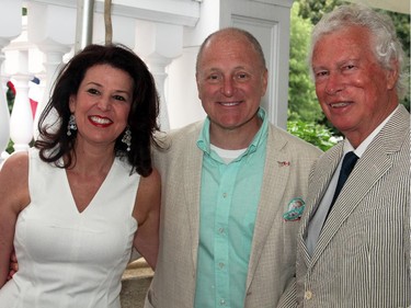 Vicki Heyman and U.S. Ambassador Bruce Heyman with former Canadian ambassador Ken Taylor at the embassy's annual Independence Day party, held Friday, July 4, 2014, at their official residence, Lornado.