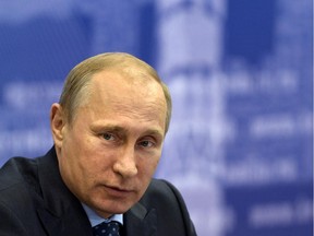 Russian President Vladimir Putin listens during a meeting in Samara, Russia, Monday, July 21, 2014.