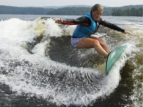 Wake surfer, Jodi Grassman, competes in the Canadian Wake Surf Nationals in Calabogie Lake Friday July 25, 2014. The premier wake surfing event runs until Sunday.