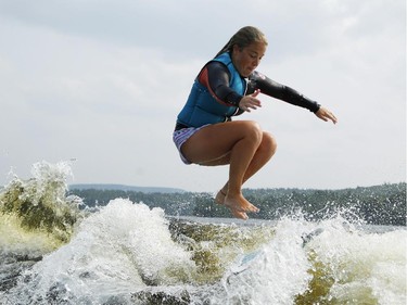 Wake surfer, Jodi Grassman, loses her board as she competes in the Canadian Wake Surf Nationals in Calabogie Lake Friday July 25, 2014. The premier wake surfing event runs until Sunday.