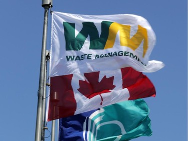Waste Management, Canadian and Ottawa flags fly at entrance to the Carp Road landfill.