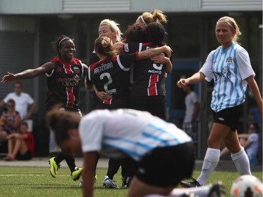 Women's Ottawa Fury FC celebrate a goal against Kitchener-Waterloo United FC during play action at Algonquin College Field on Saturday, July 19, 2014.