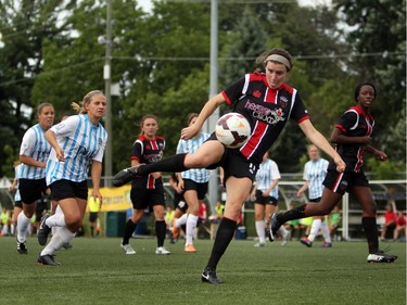 Women's Ottawa Fury FC's Annie Steinlage eyes a ball as kicks it upfield against Kitchener-Waterloo United FC during play action at Algonquin College Field on Saturday, July 19, 2014. (Cole Burston/Ottawa Citizen)