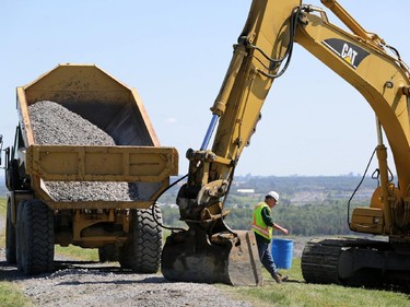 Workers are building a new well near the top of "Carp Mountain" at Carp Road landfill.