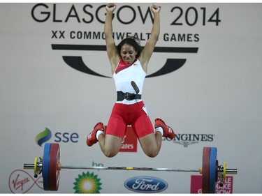 Zoe Smith of England leaps for joy as she wins the gold medal in the women's 58 kg weightlifting competition the Commonwealth Games Glasgow 2014, in Glasgow, Scotland, Saturday July 26, 2014.