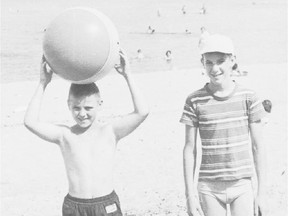 Ron Cole, left, and Duncan Cumming as children at an Ottawa beach in the 1950s. The two childhood friends recently discovered that they are biological brothers.