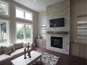 The fireplace was placed on an inside wall to avoid disrupting the glazing on the outside wall and allowing for built-ins on either side.