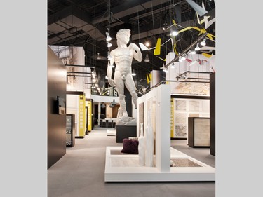 A 17-foot tall replica of Michelangelo's David fronts a Champs Élysées-style central aisle and is the first thing visitors see in Euro Tile & Stone’s new showroom. Clad in 508 square feet of glass mosaic tile (about 365,000 tile pieces), he's meant to create a 'wow' effect.