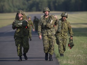 Corporal Jason Nolet, Sergeant Brent Currie and Corporal Mohammad Balouch from the Land Task Force of Operation REASSURANCE did a wings exchange jump from a CC-130J Hercules from 436 Squadron Trenton in Eastern Europe on August 21, 2014.  Photo by Lt J-F Carpentier, 2 CMBG PAO PA2014-0145-678 ORG XMIT: PA2014-0145
