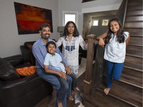 Suthakar and Malini Pakianathan with Surya (boy) age five and Mira (girl) age nine. Housing expectations of New Canadians. (Pat McGrath / Ottawa Citizen)