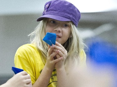 Nine-year-old Addison is one of the Spy Camp Kids at the Diefenbunker in Carp are folding paper cranes in an Origami class to send to Japan. They hope is to make between 600 and 1,000 cranes.