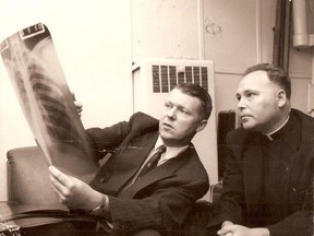 Bill Jeanes reading X-rays aboard the Christmas Seal hospital ship that used to visit Newfoundland outports to test residents for Tuberculosis