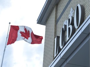 A Canadian flag flies near an LCBO store in Bowmanville, Ontario on Saturday July 20, 2013.