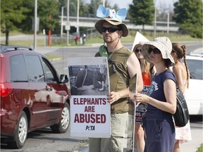 Animal rights activists protest outside the Shrine Circus at the RA Centre in Ottawa on Sunday, August 10, 2014.