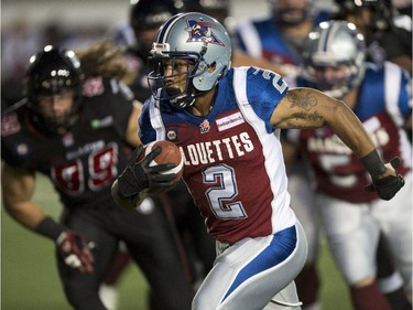 Montreal Alouettes running back Brandon Whitaker runs with the ball asthey face the Ottawa Redblacks during first quarter CFL football action Friday, August 29, 2014 in Montreal.