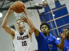 Carleton Ravens #10 Connor Wood goes for a shot during the match between Carleton University Ravens men's basketball team against University of Memphis Tigers at Carleton University on Tuesday, Aug. 19, 2014.