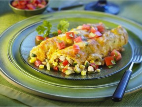 Chicken, Corn and Zucchini Enchiladas are delicious, topped with melted cheese and full of seasonal produce.