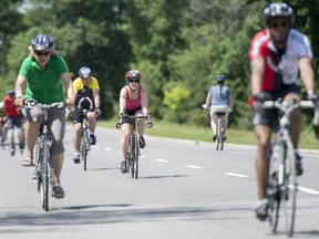Cyclists ride along Sir John A. Macdonald Parkway in Ottawa on Sunday, June 15, 2014. The NCC's Sunday Bikeday program closes parkways around Ottawa to traffic for cyclists and inline skaters.