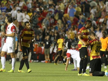 Darryl Gordon #34 celebrates with teammate Rafael Alves #33 of the Fort Lauderdale Strikers after beating the Ottawa Fury 2-1 during an NASL match at TD Place in Ottawa on August 9, 2014.