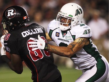 Dobson Collins (80) of the Ottawa Redblacks is tackled by Macho Harris (3) of the Saskatchewan Roughriders as Collins makes a catch way down field during the second half of CFL game action at TD Place in Ottawa on Saturday, Aug. 2, 2014.