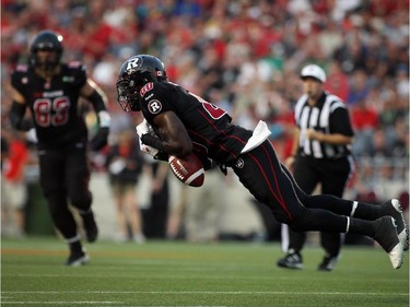 Dobson Collins of the Ottawa Redblacks drops a reception against the Saskatchewan Roughriders during the first half of CFL game action at TD Place in Ottawa on Saturday, Aug. 2, 2014. (Cole Burston/Ottawa Citizen)