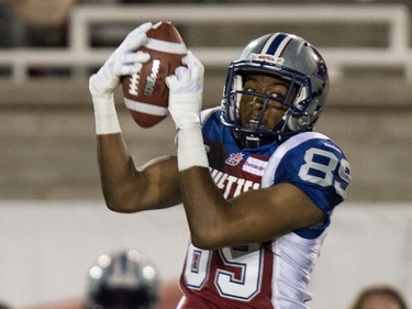 Montreal Alouettes wide receiver Duron Carter catches a pass as they face the Ottawa Redblacks during second quarter CFL football action Friday, August 29, 2014 in Montreal.