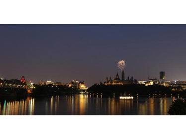 Dusk falls over Parliament Hill prior to Casino du Lac-Leamy Sound of Light fireworks, Aug. 2, 2014.