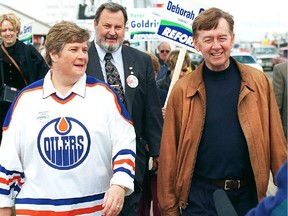 Reform leader Preston Manning and Reform MP Deborah Grey, with her Oilers jersey,  make a campaign stop Wednesday in Edmonton, in 1997. The Reform party opposed the Charlottetown accord, saying Canadians should "know more."