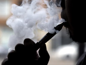 File art - A person uses an e-cigarette.